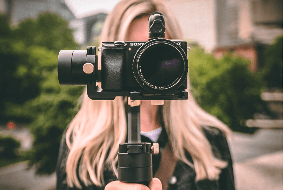 personalized video marketing woman with sony camera filming a video