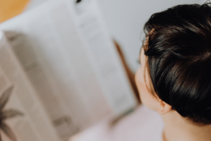 women reading newspaper october industry news